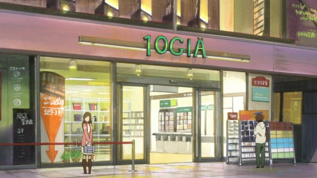 Yui sees a red guitar at the music store